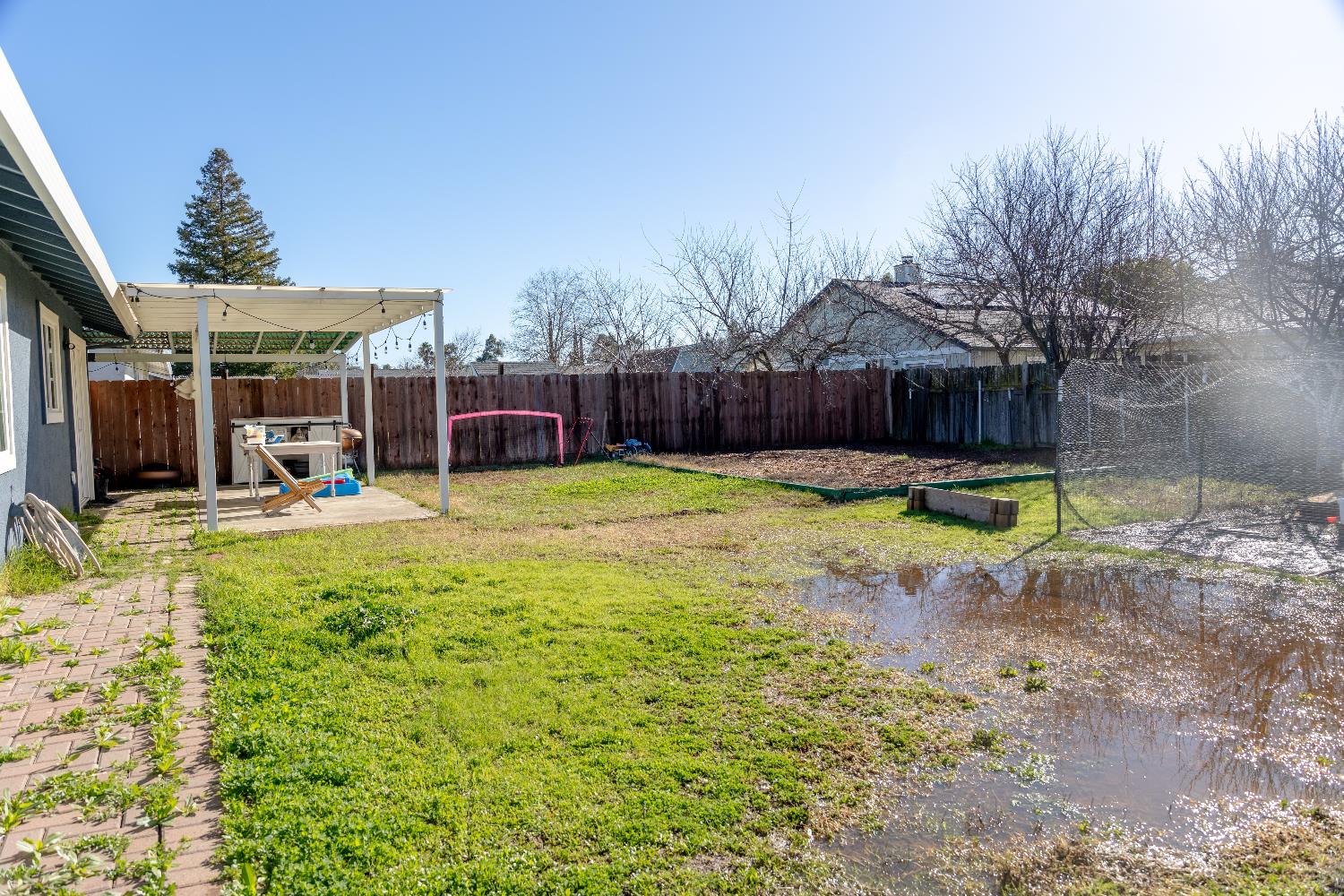 1612 Larry Street Olivehurst, CA 95961 - Photo 26 of 27 a view of a house with swimming pool and a yard