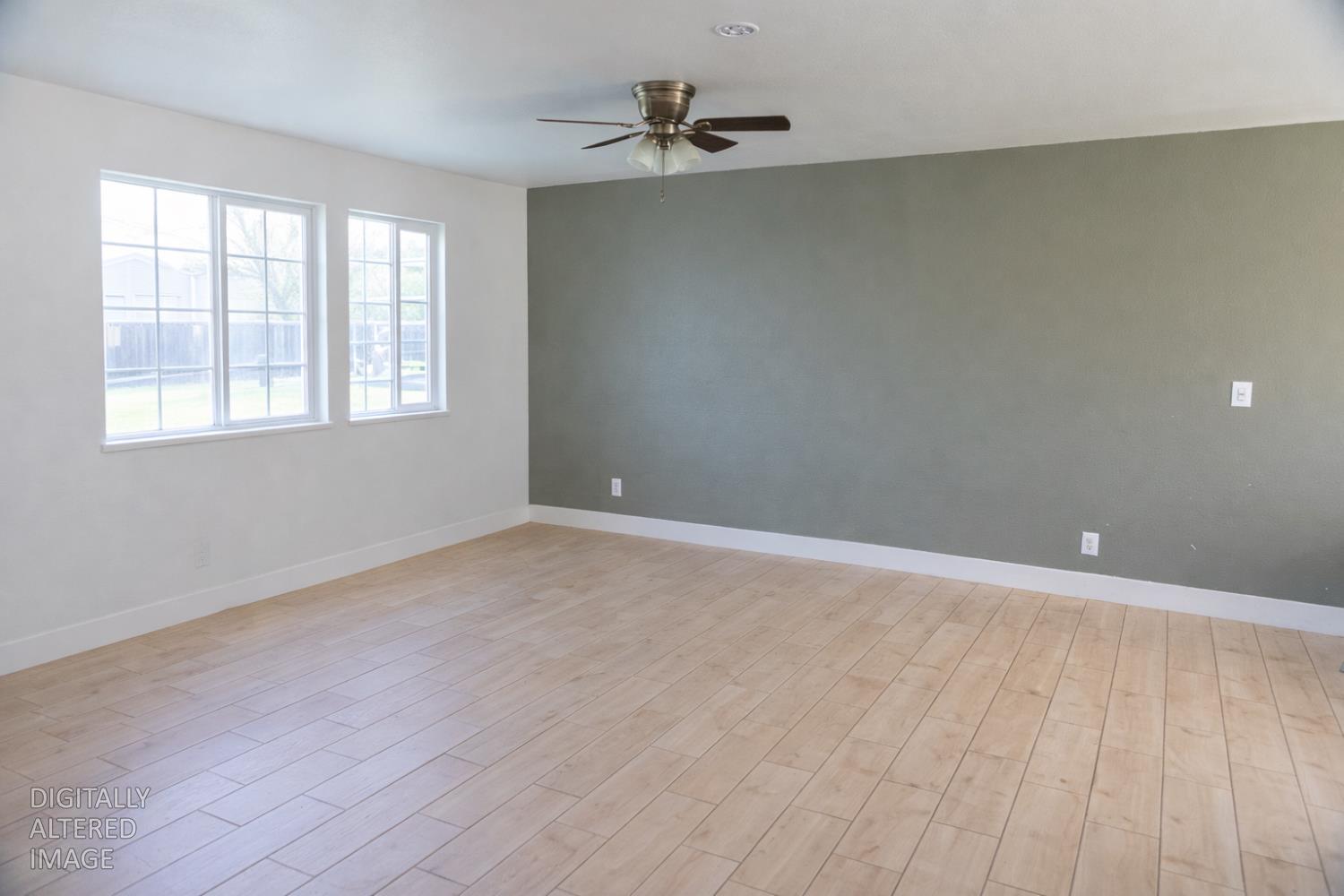 1612 Larry Street Olivehurst, CA 95961 - Photo 3 of 27 wooden floor in an empty room with a window