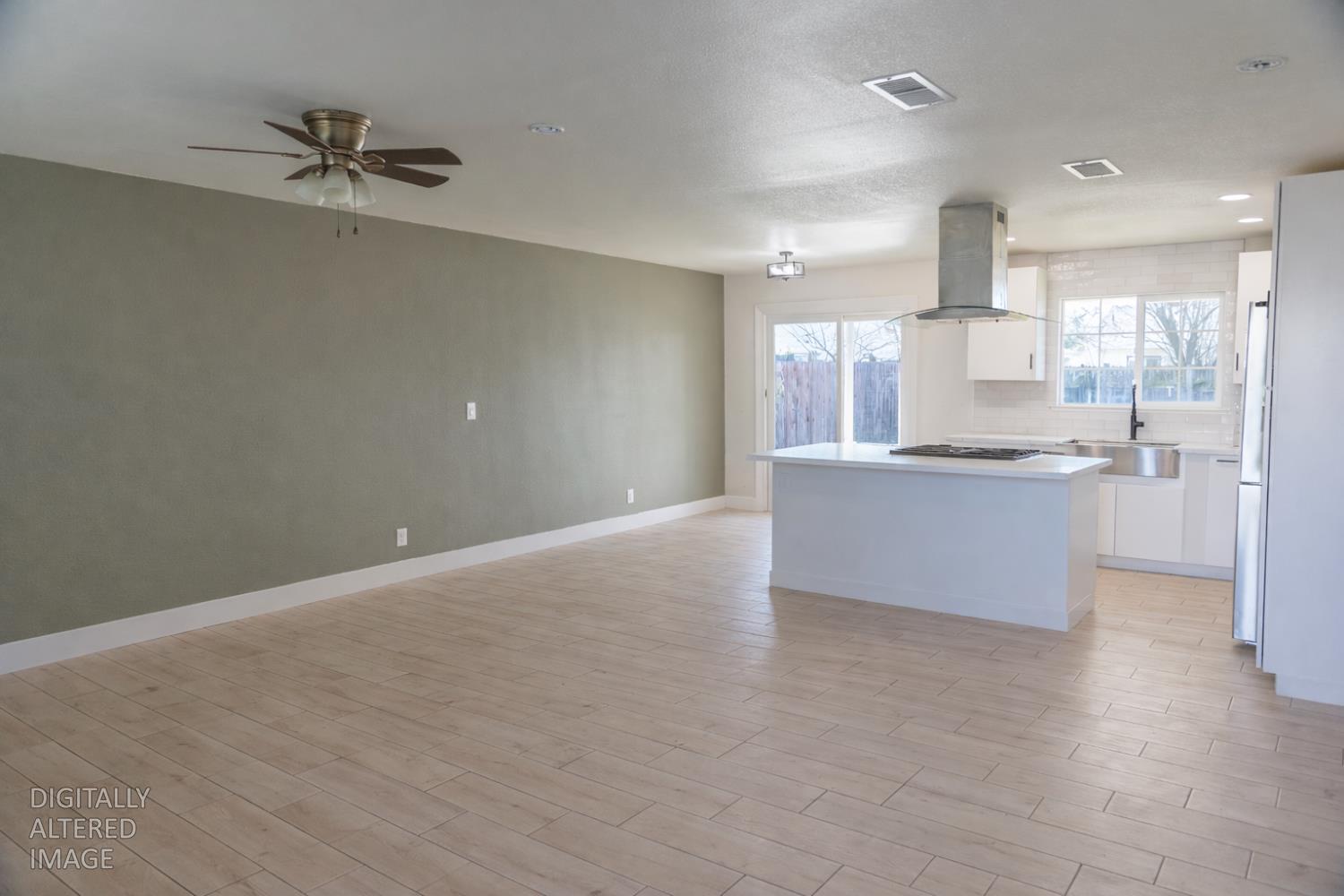 1612 Larry Street Olivehurst, CA 95961 - Photo 4 of 27 a view of a kitchen with a sink and cabinets