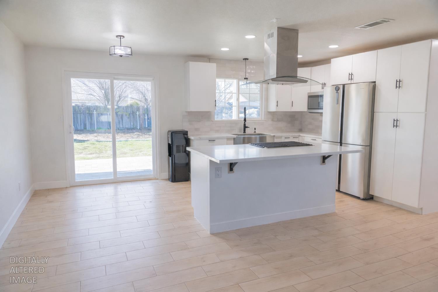 1612 Larry Street Olivehurst, CA 95961 - Photo 5 of 27 a kitchen with stainless steel appliances granite countertop a refrigerator a sink dishwasher a stove and a refrigerator with wooden floor