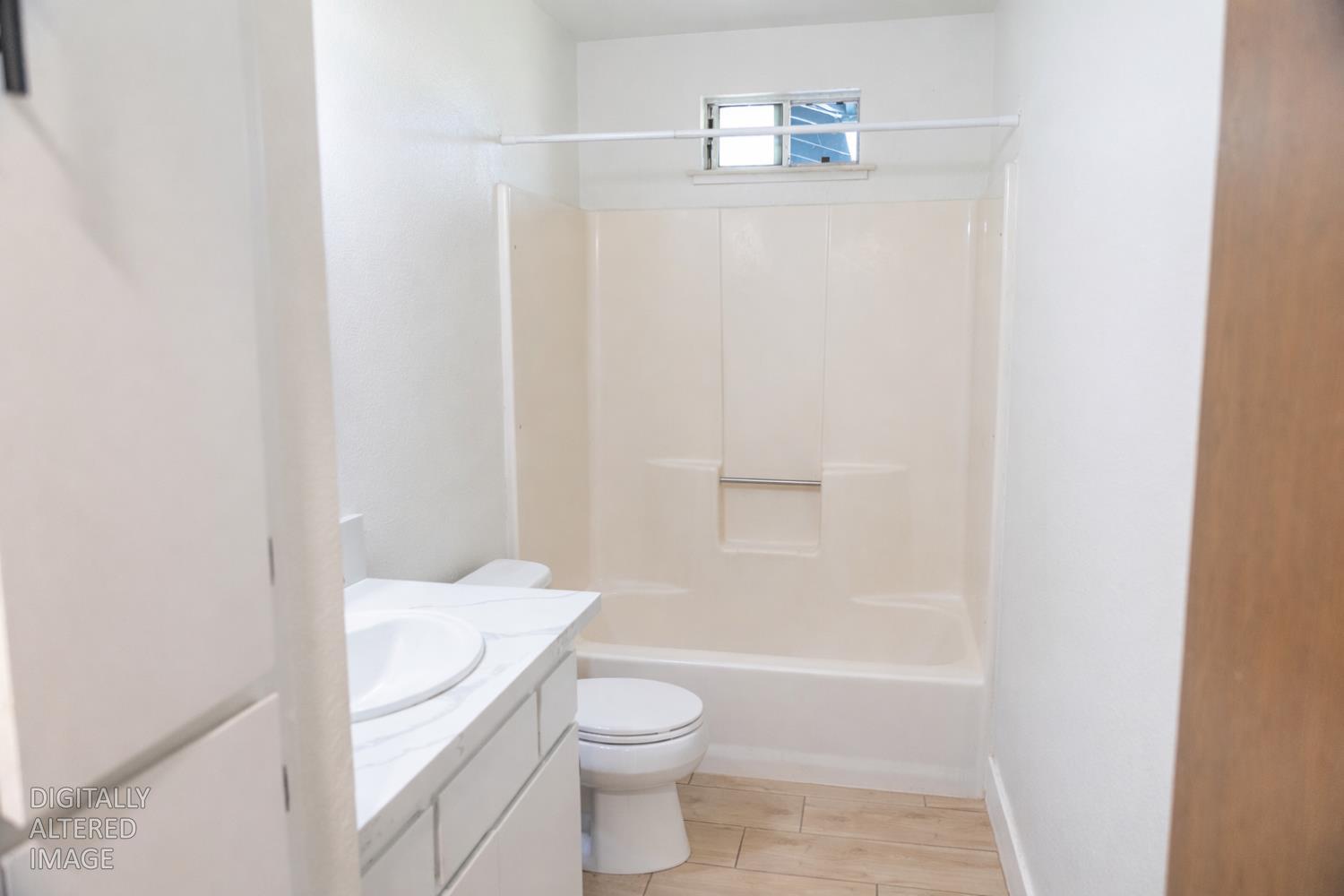 1612 Larry Street Olivehurst, CA 95961 - Photo 8 of 27 a bathroom with a sink a toilet and shower