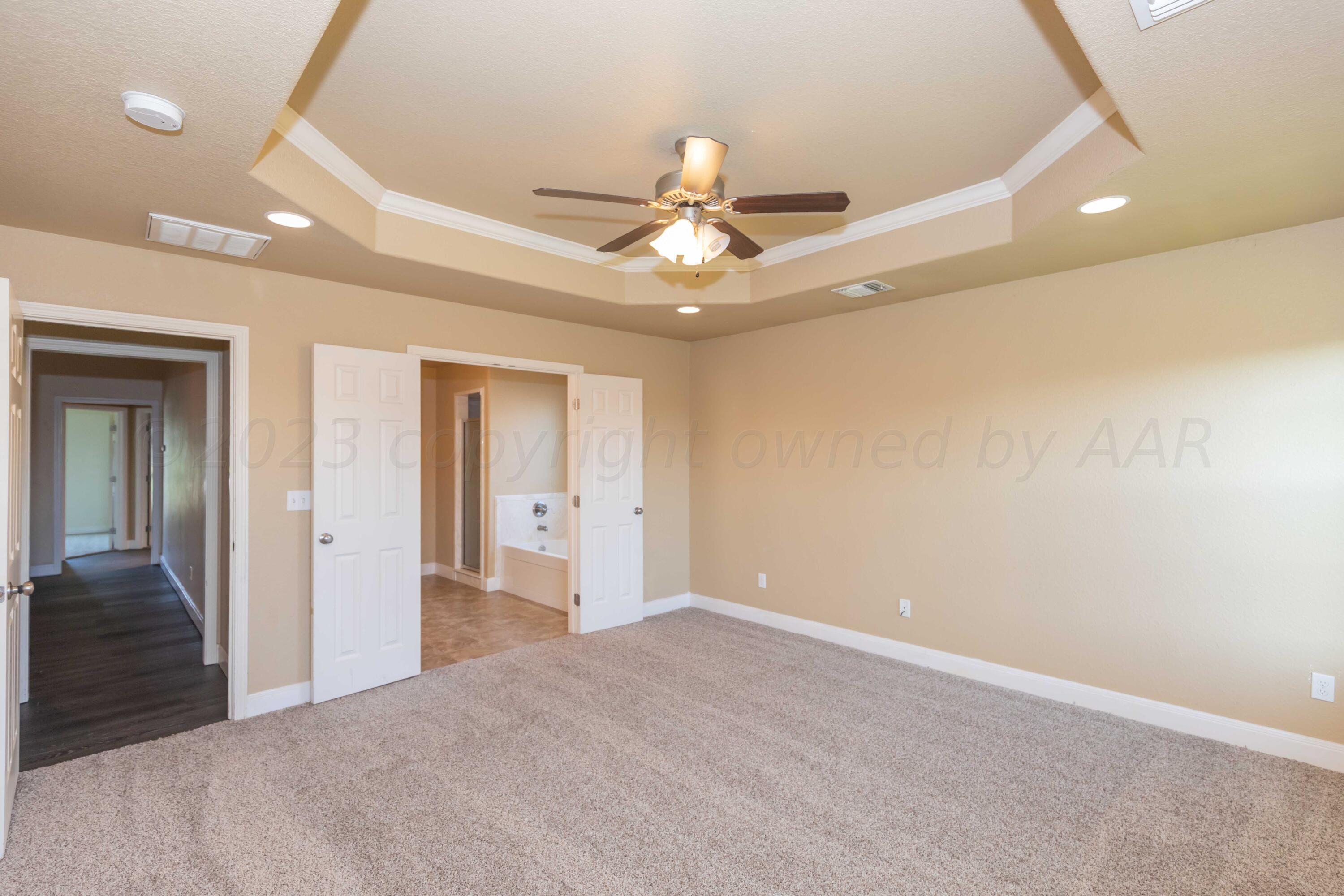 3904 Arden Road Amarillo, TX 79118 - Photo 19 of 45 a view of a livingroom with a ceiling fan and window