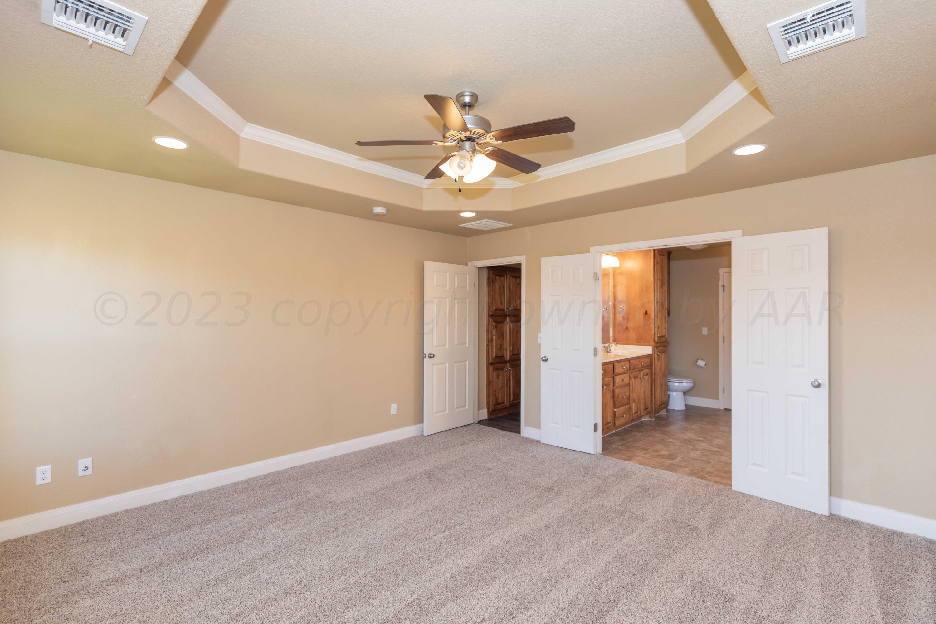 3904 Arden Road Amarillo, TX 79118 - Photo 20 of 45 a view of an empty room and a ceiling fan