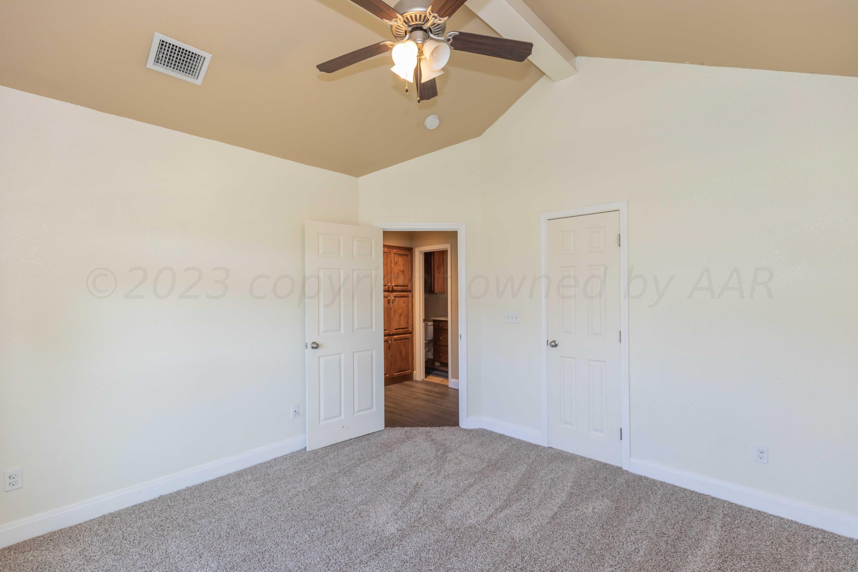 3904 Arden Road Amarillo, TX 79118 - Photo 32 of 45 an empty room with fan and windows