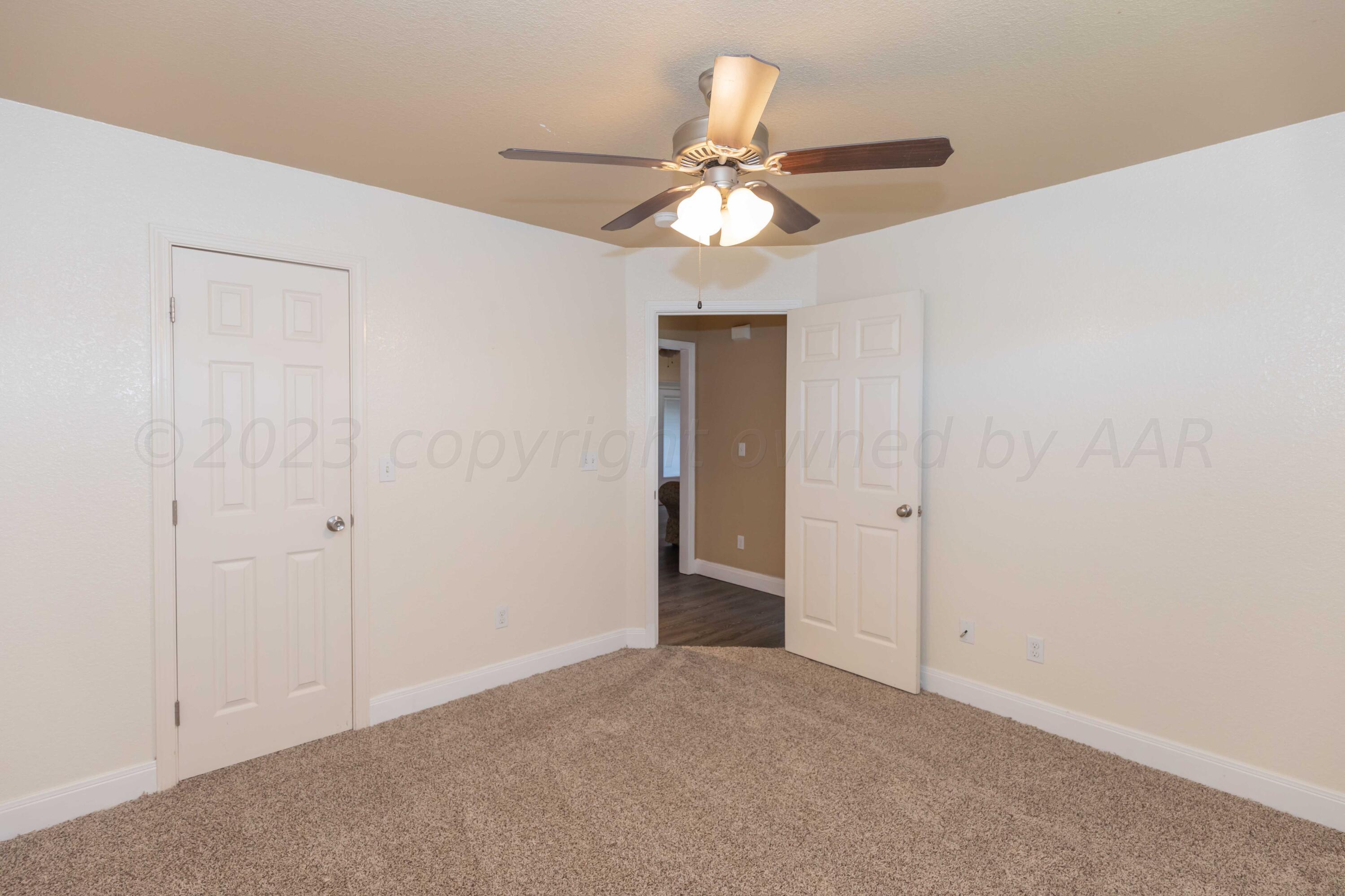 3904 Arden Road Amarillo, TX 79118 - Photo 38 of 45 a view of an empty room and chandelier fan