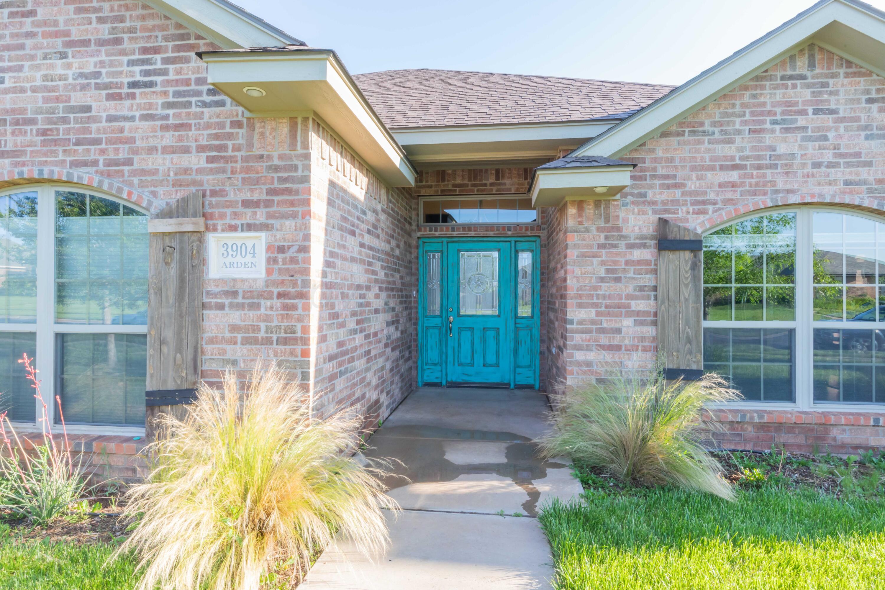 3904 Arden Road Amarillo, TX 79118 - Photo 4 of 45 a front view of a house with a garden