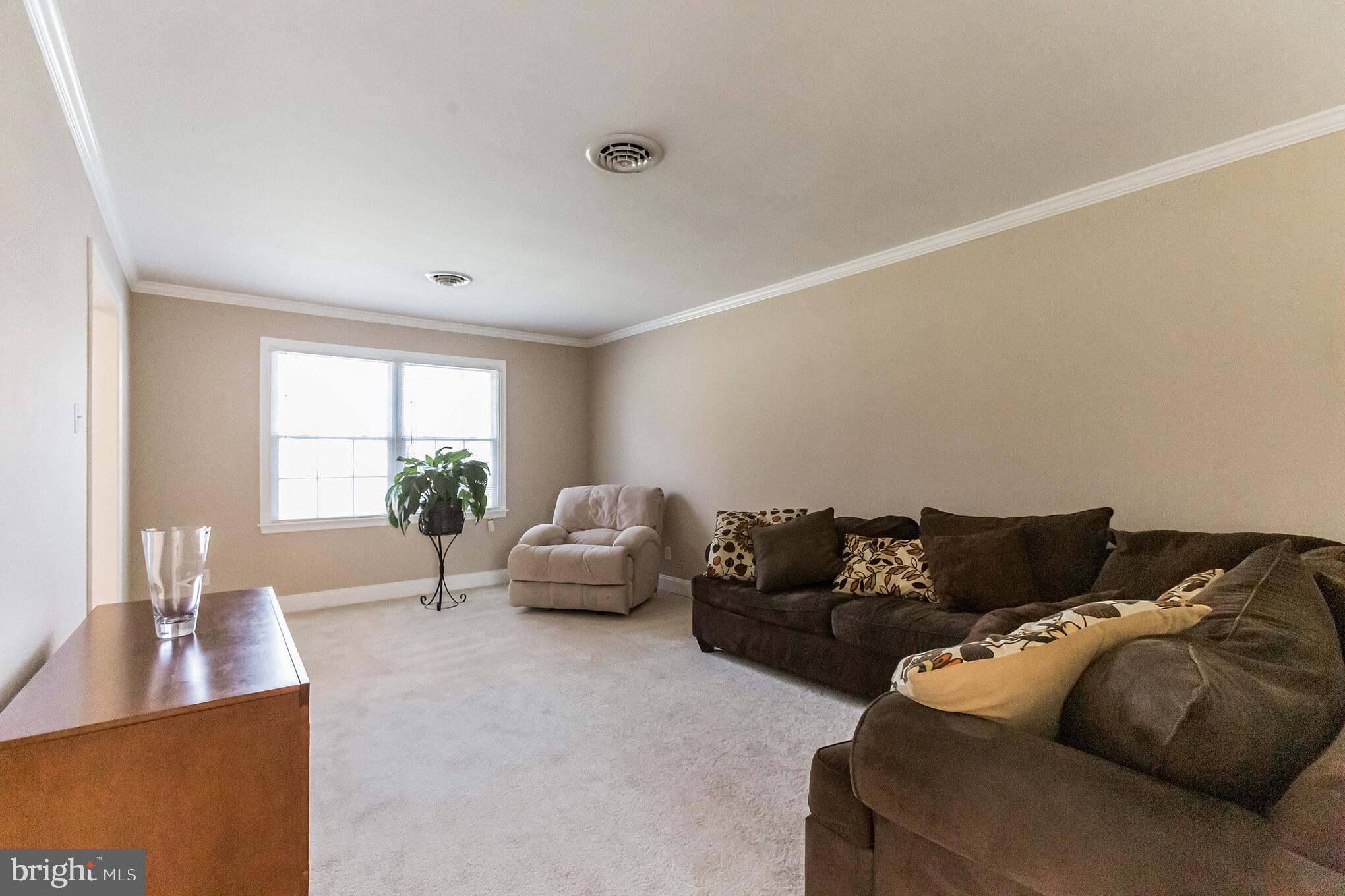 5570 Chelsea Road Aston, PA 19014 - Photo 7 of 42 Sun lit living room w/new carpet