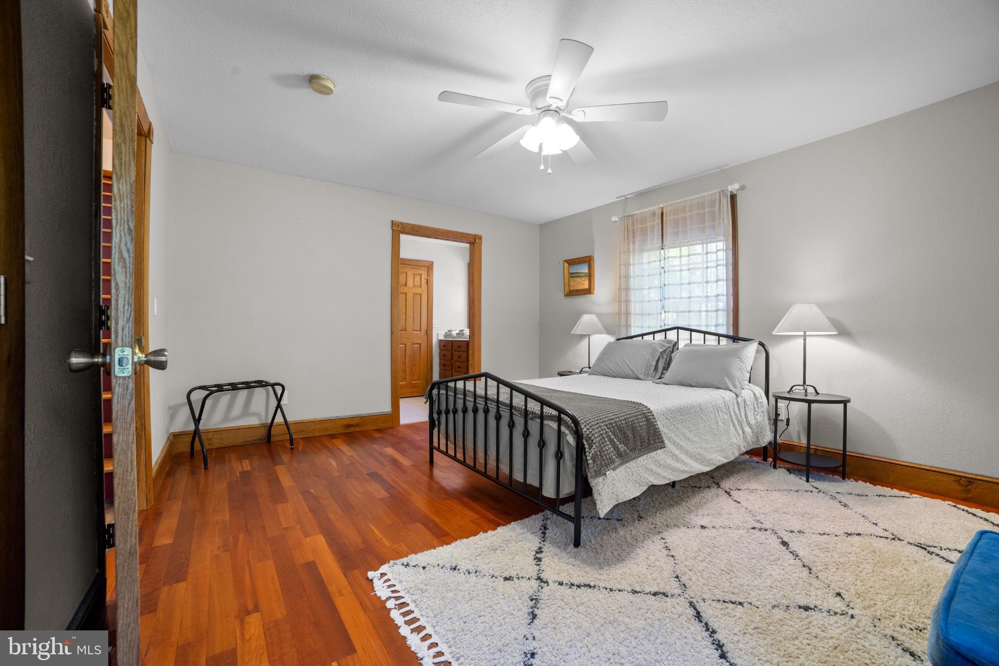 1318 Locust Grove Church Road Orange, VA 22960 - Photo 14 of 42 Bright primary bedroom with hardwood floors.