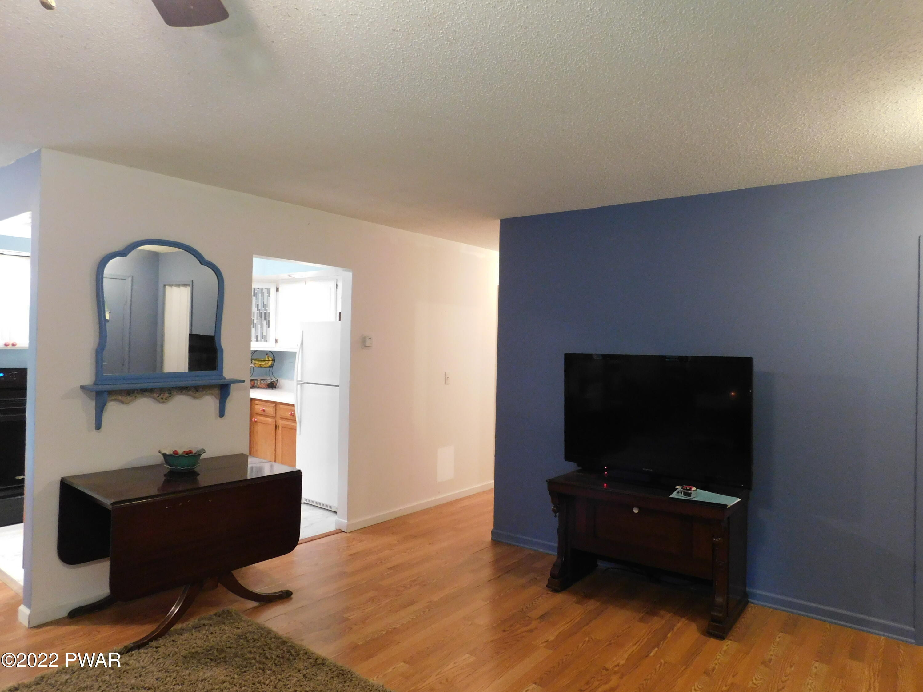 191 Fox Road Dingmans Ferry, PA 18328 - Photo 14 of 27 a living room with furniture and a flat screen tv