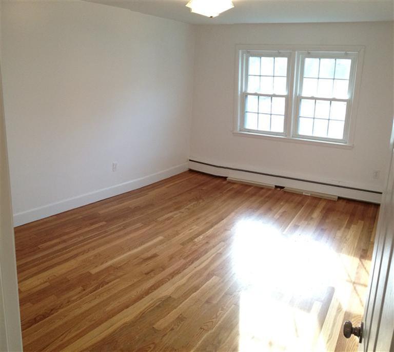 18 Great Marsh Road Centerville, MA 02632 - Photo 17 of 28 an empty room with wooden floor and windows
