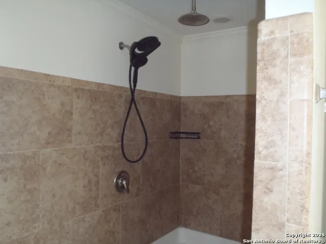a bath tub sitting in a bathroom next to a window