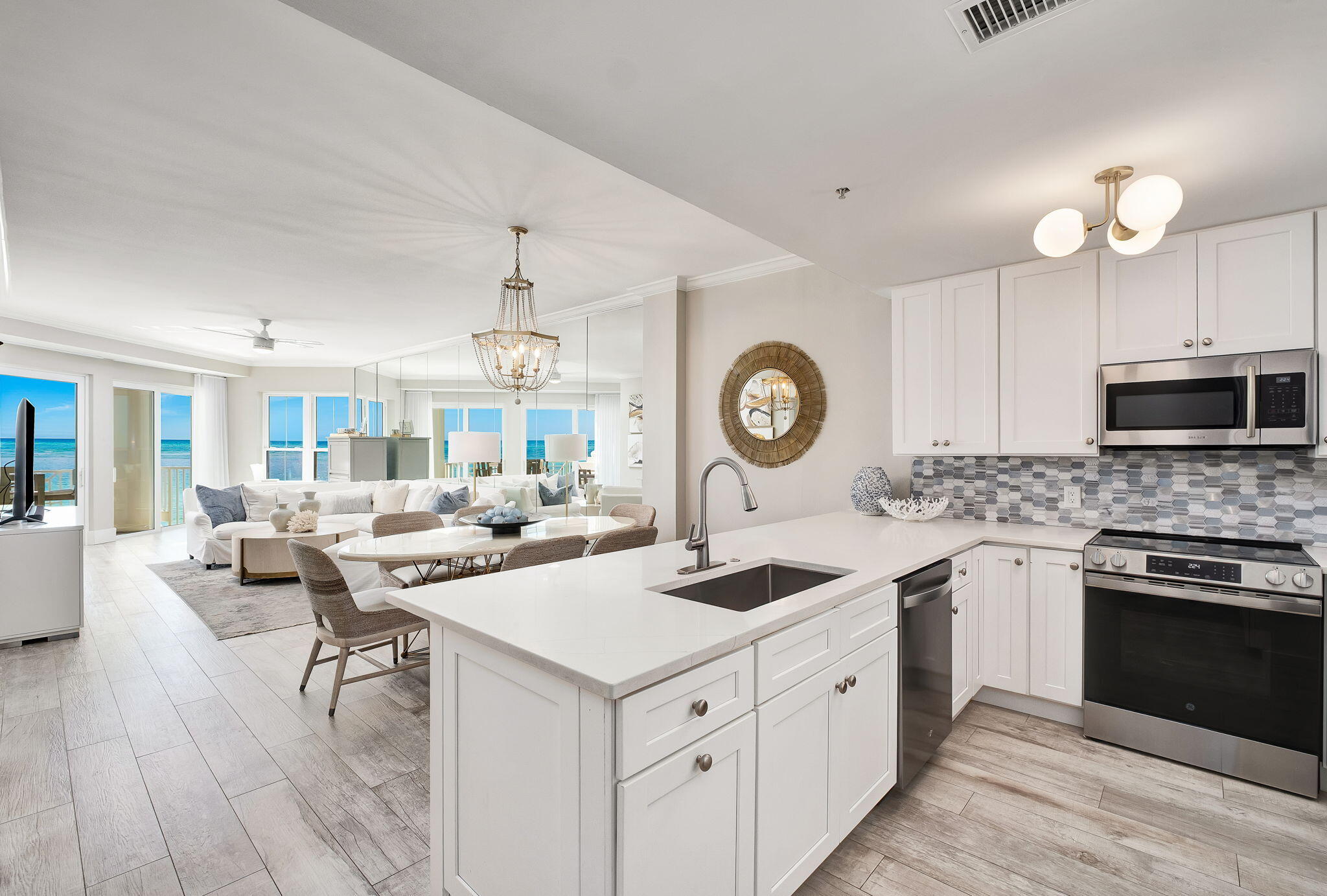 164 Blue Lupine Way, Unit 313 Santa Rosa Beach, FL 32459 - Photo 11 of 57 a kitchen with a sink stove and microwave