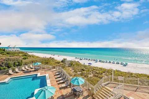 an outdoor space with swimming pool and barbeque oven