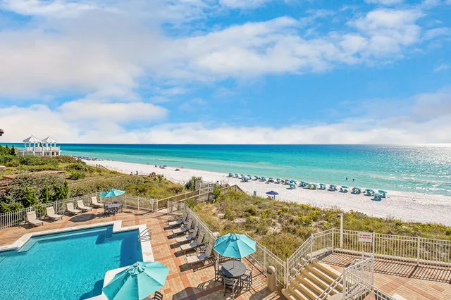an outdoor space with swimming pool and barbeque oven