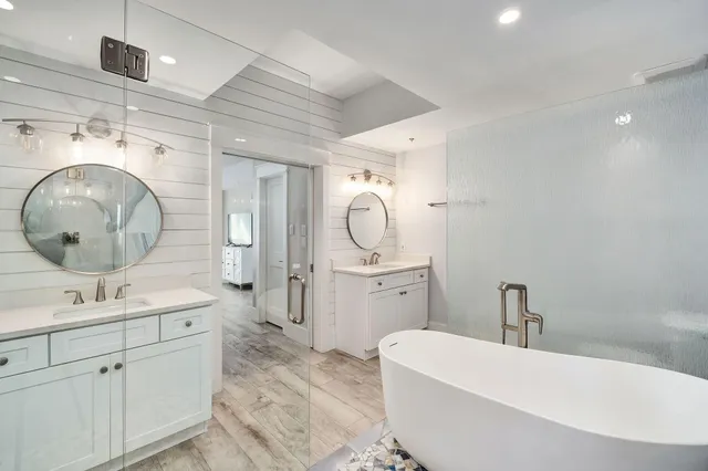 a bedroom with a bed and a flat tv screen on wall