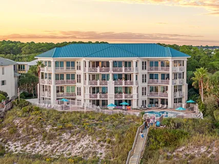 a view of an ocean with a multi story building