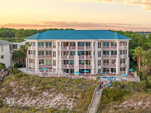 a view of an ocean with a multi story building