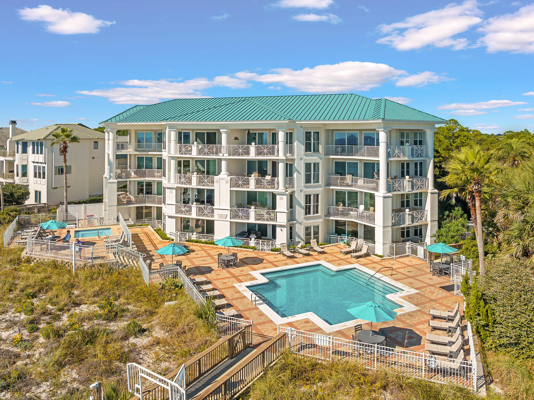 164 Blue Lupine Way, Unit 313 Santa Rosa Beach, FL 32459 - Photo 39 of 57 a view of a swimming pool with a lounge chair