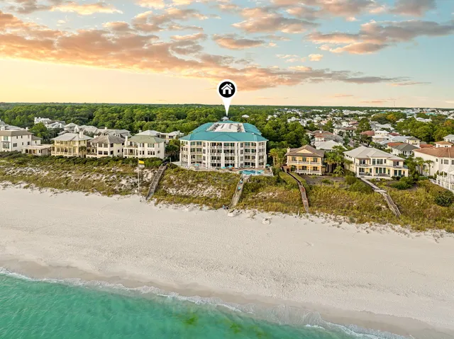 an aerial view of multiple house with yard