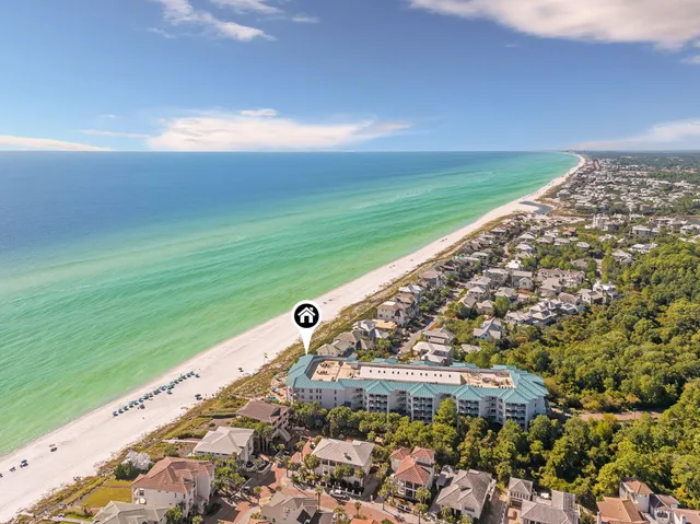 a view of backyard with deck and outdoor seating