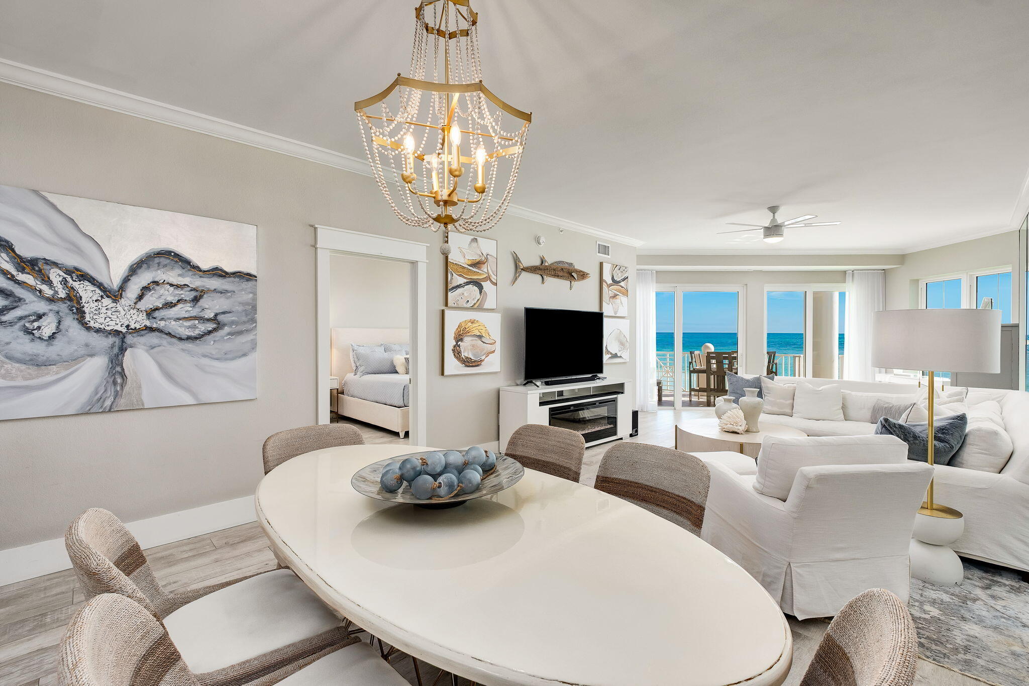 164 Blue Lupine Way, Unit 313 Santa Rosa Beach, FL 32459 - Photo 8 of 57 a living room with furniture a chandelier and a flat screen tv