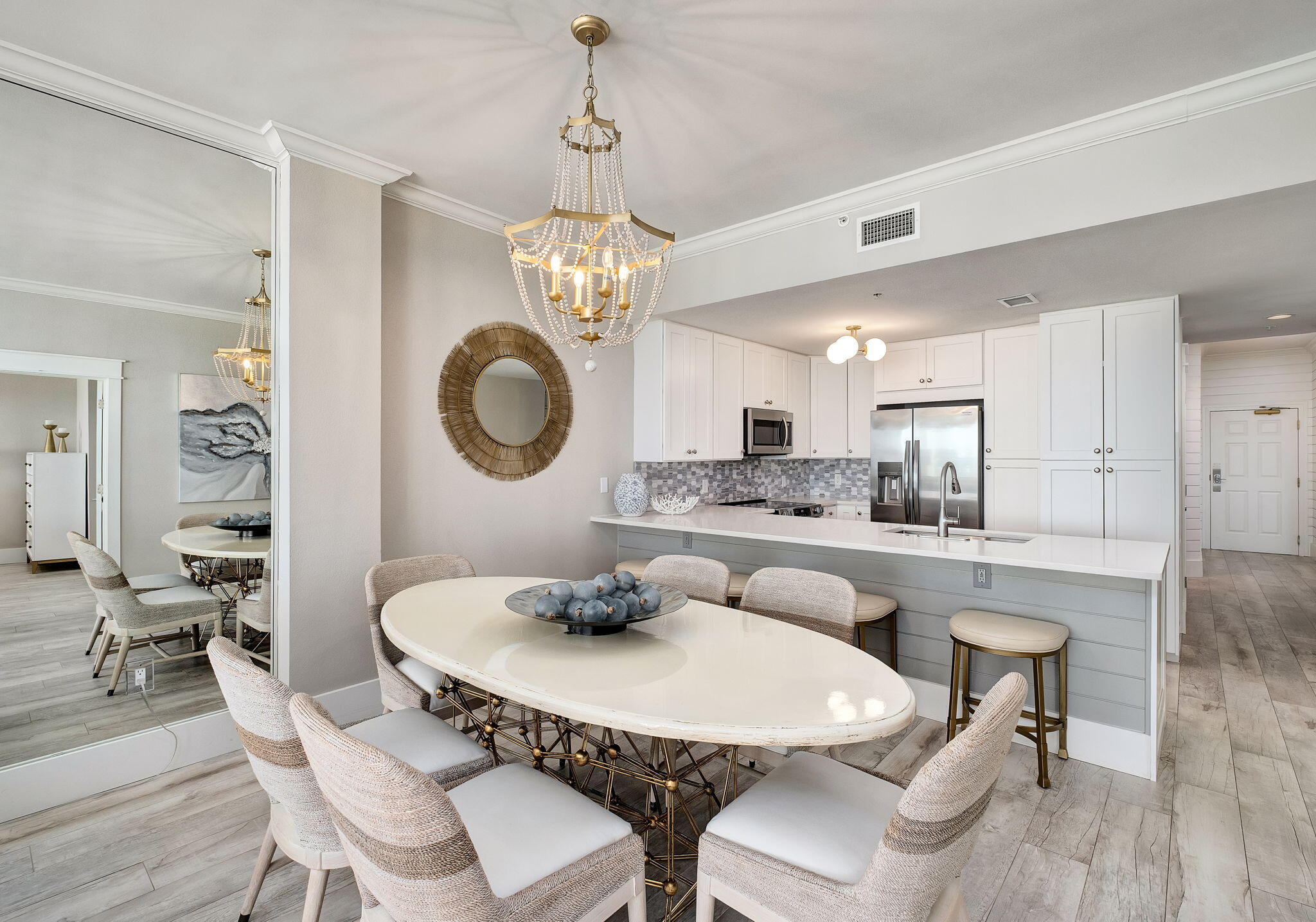 164 Blue Lupine Way, Unit 313 Santa Rosa Beach, FL 32459 - Photo 9 of 57 a view of a dining room with furniture a chandelier and wooden floor
