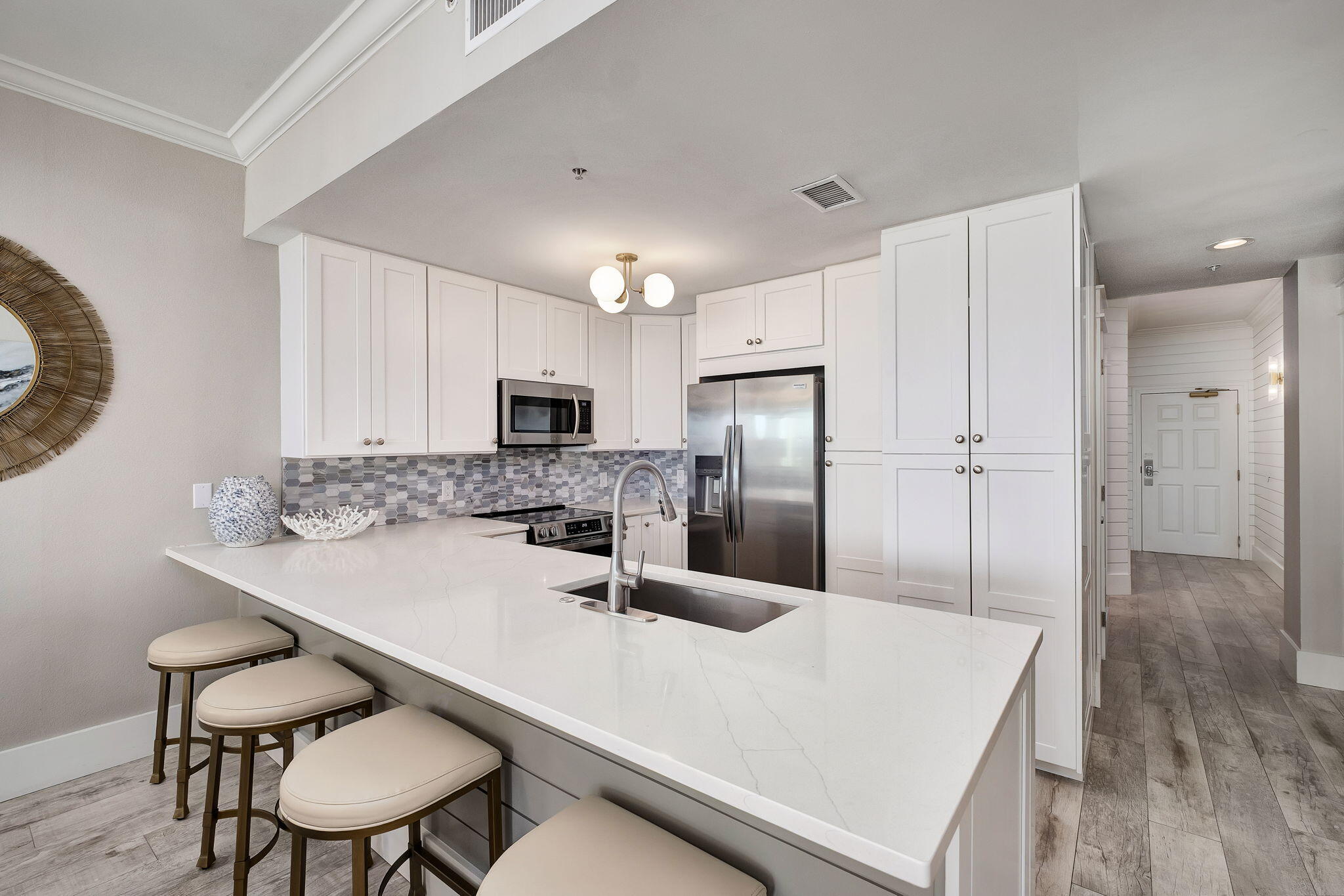 164 Blue Lupine Way, Unit 313 Santa Rosa Beach, FL 32459 - Photo 10 of 57 a kitchen with kitchen island a refrigerator stove and microwave