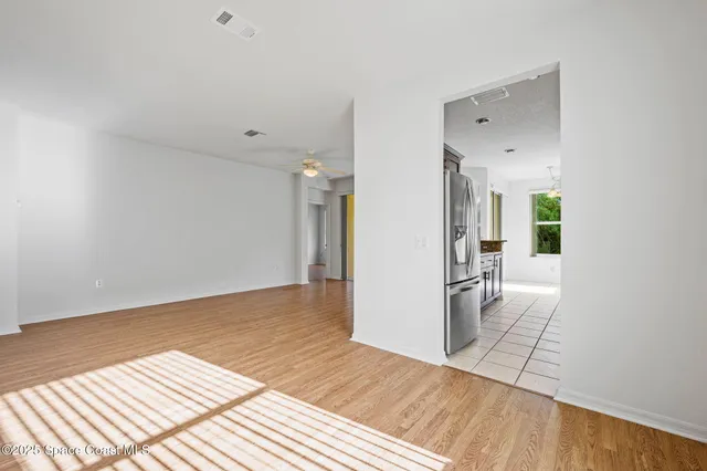a view of a bedroom from a hallway