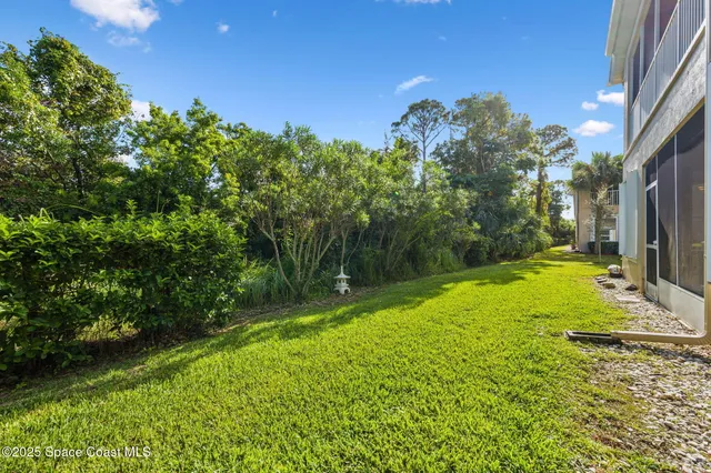 a backyard of a house with lots of green space