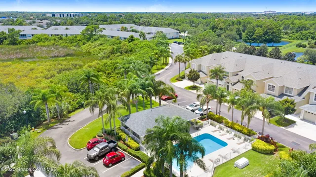an aerial view of a house with a garden