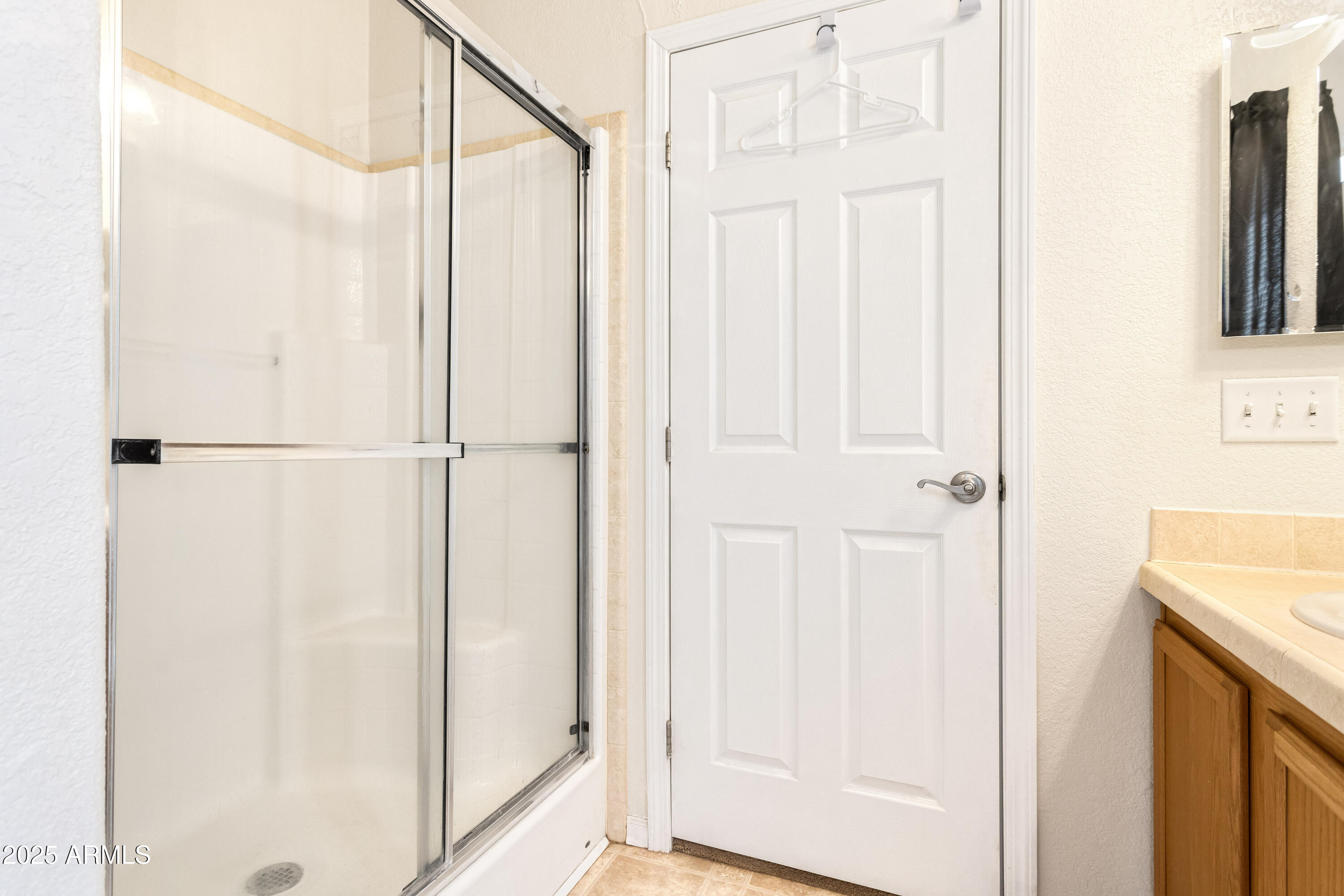 3526 West Rak Road Douglas, AZ 85607 - Photo 19 of 51 a bathroom with a shower and a sink