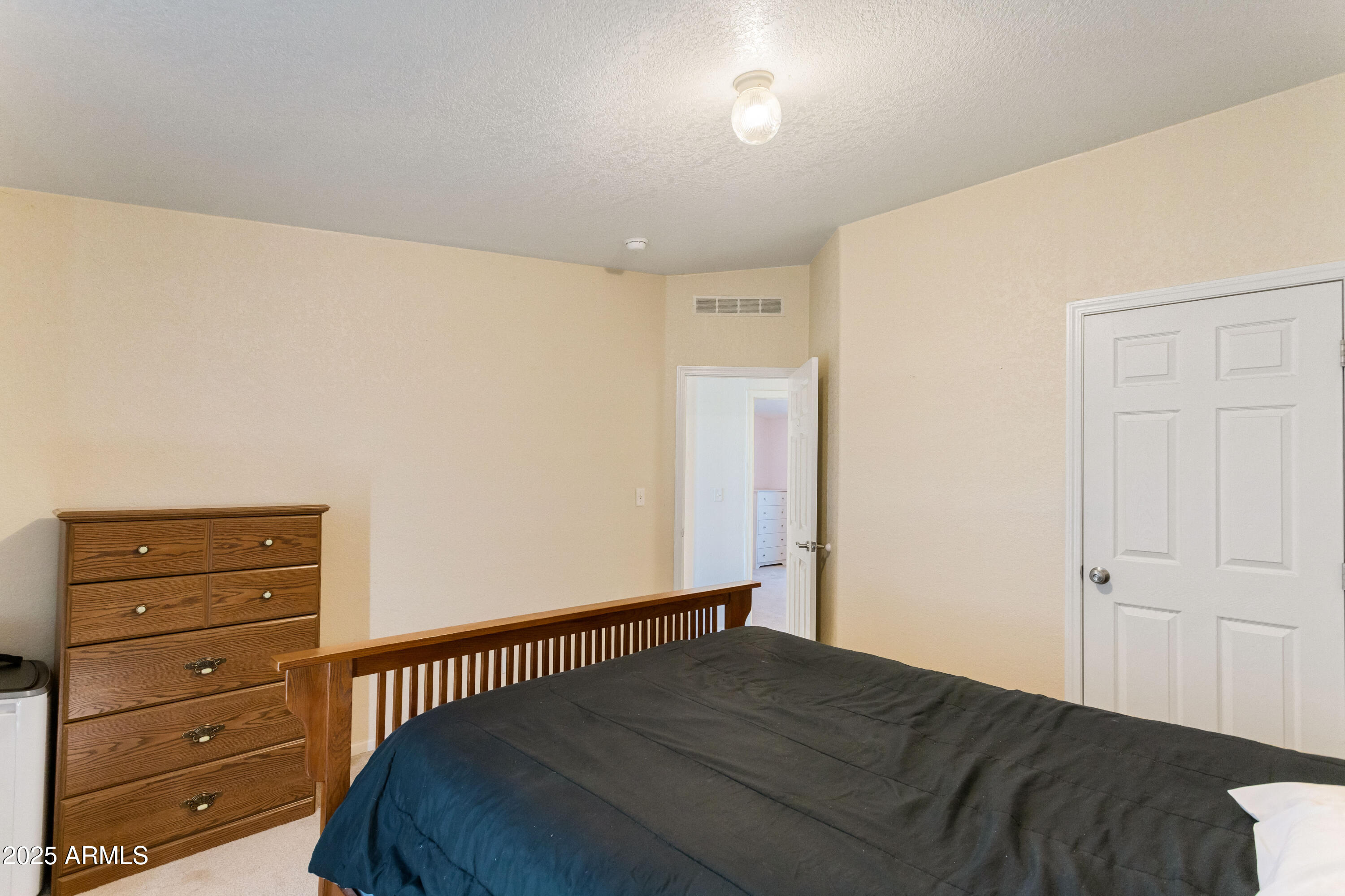 3526 West Rak Road Douglas, AZ 85607 - Photo 23 of 51 a bedroom with a bed and a dresser