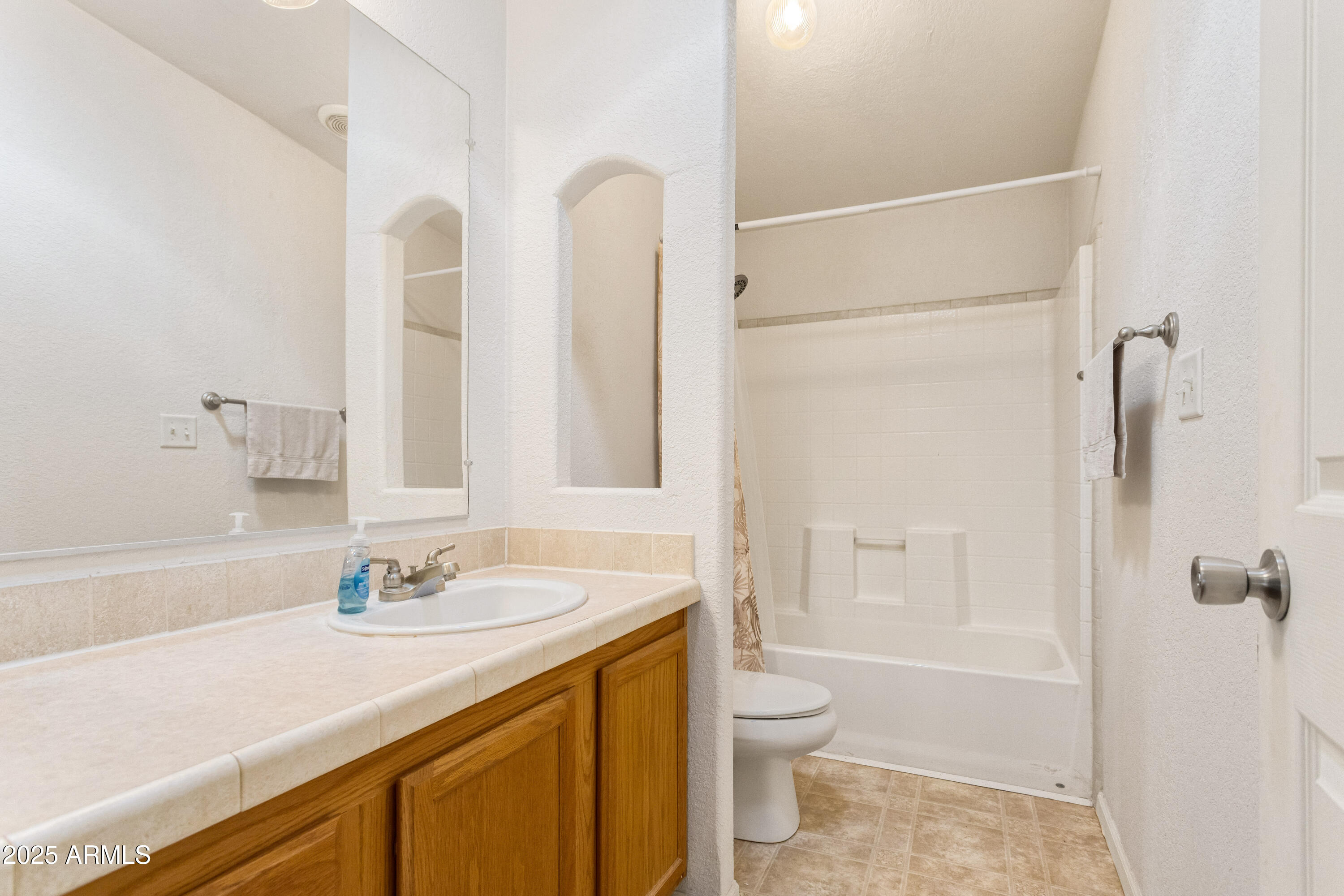 3526 West Rak Road Douglas, AZ 85607 - Photo 24 of 51 a bathroom with a sink a toilet and shower