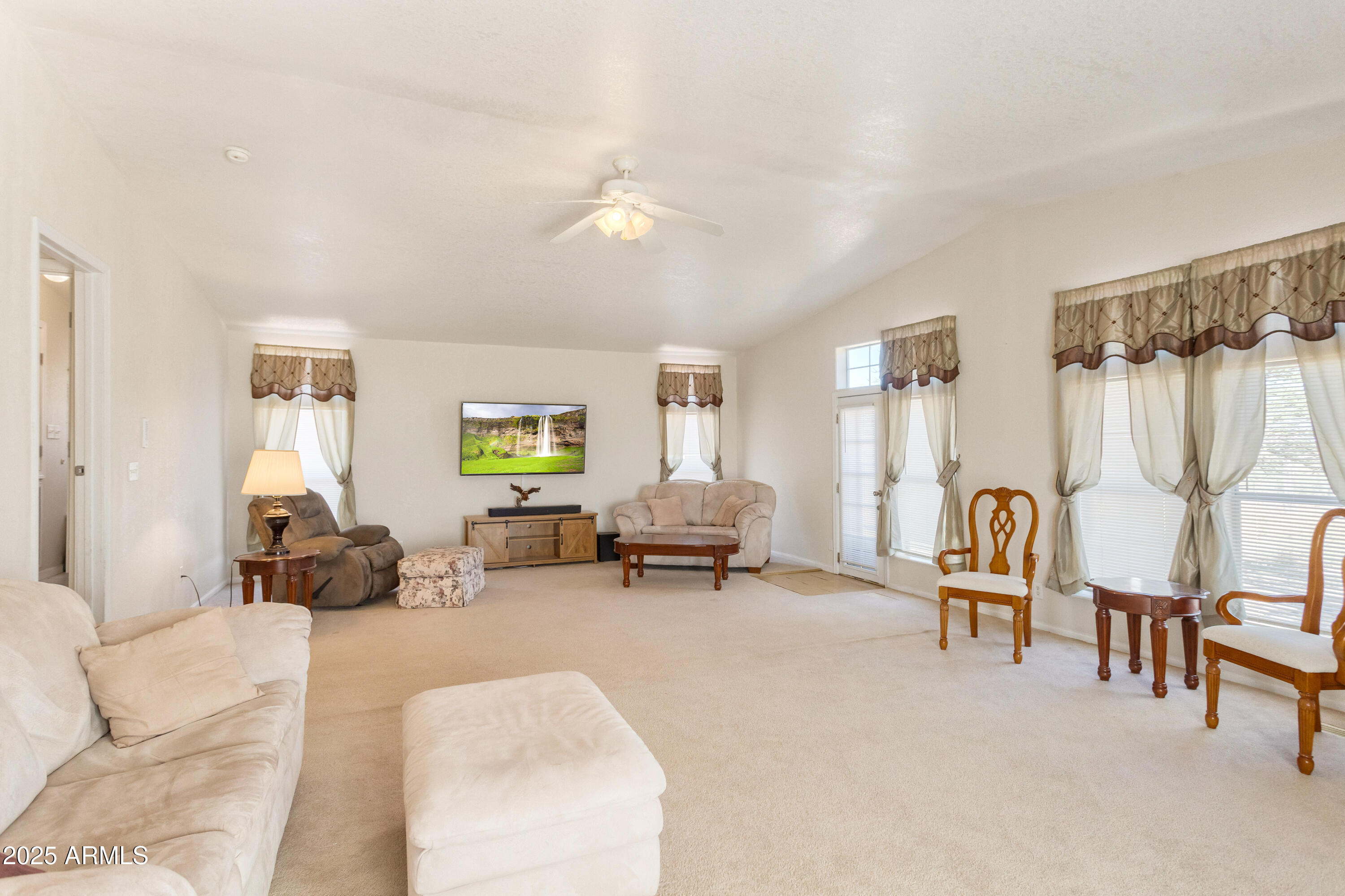 3526 West Rak Road Douglas, AZ 85607 - Photo 25 of 51 a living room with furniture and a chair