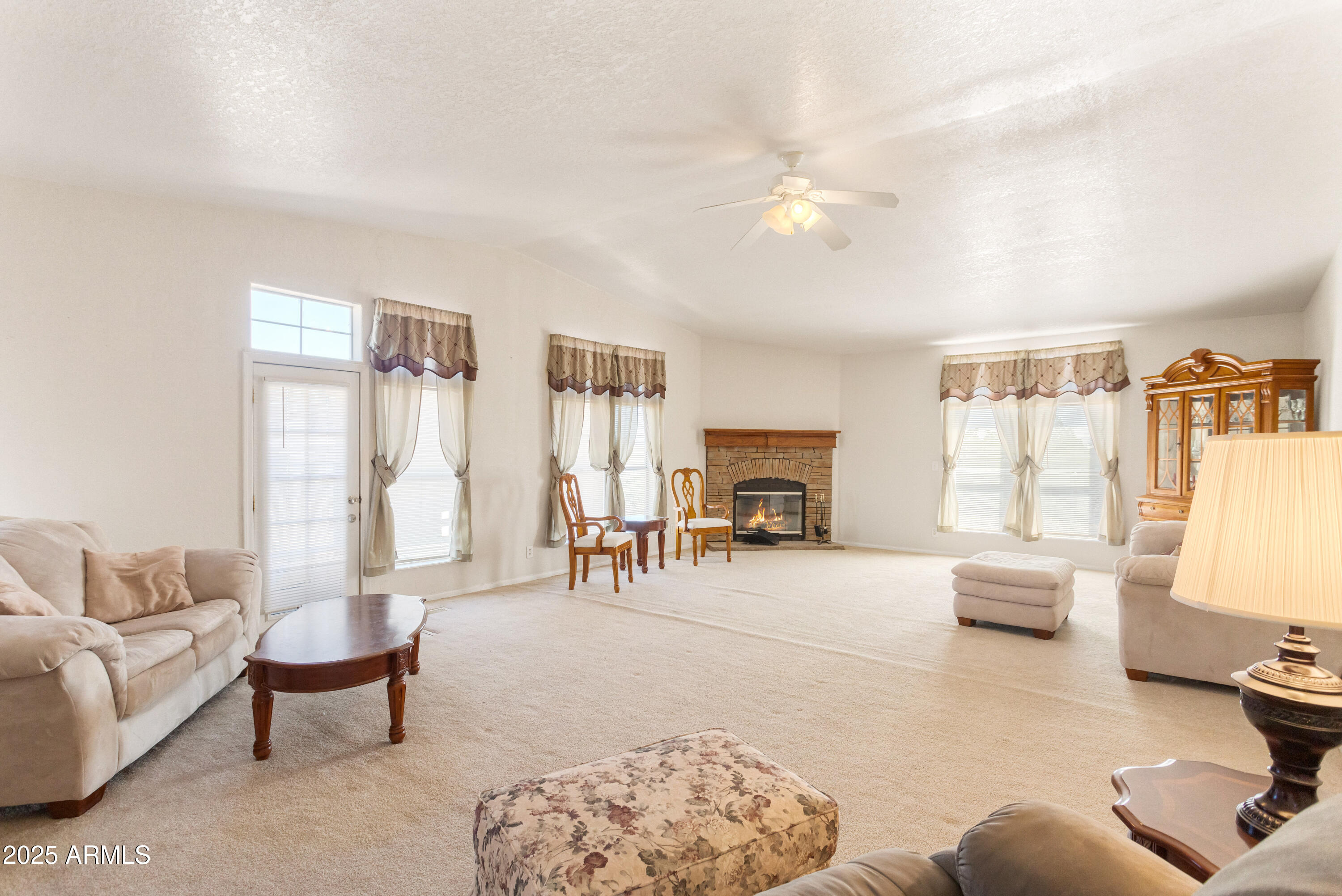3526 West Rak Road Douglas, AZ 85607 - Photo 26 of 51 a living room with furniture and a large window