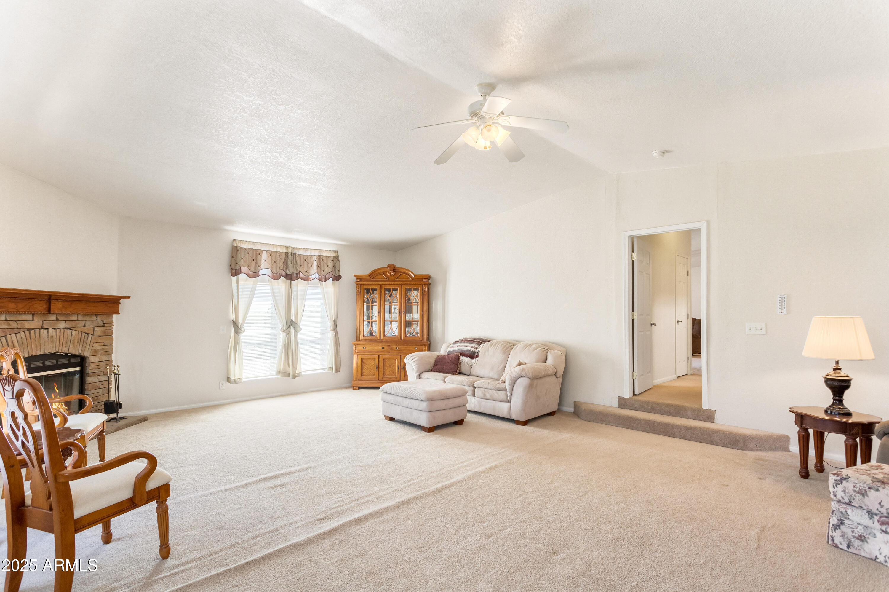 3526 West Rak Road Douglas, AZ 85607 - Photo 27 of 51 a living room with furniture and a fireplace