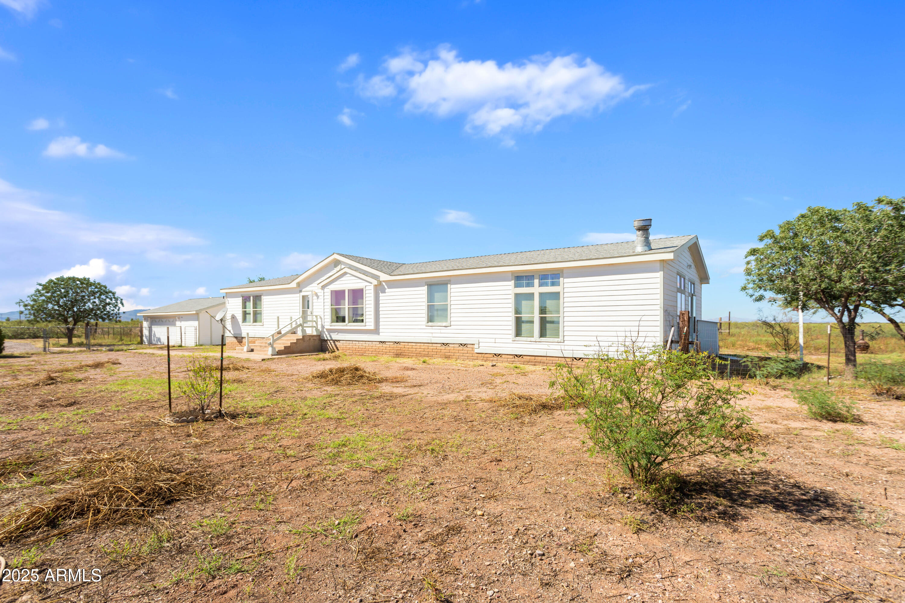 3526 West Rak Road Douglas, AZ 85607 - Photo 2 of 51 a house view with swimming pool in front of house
