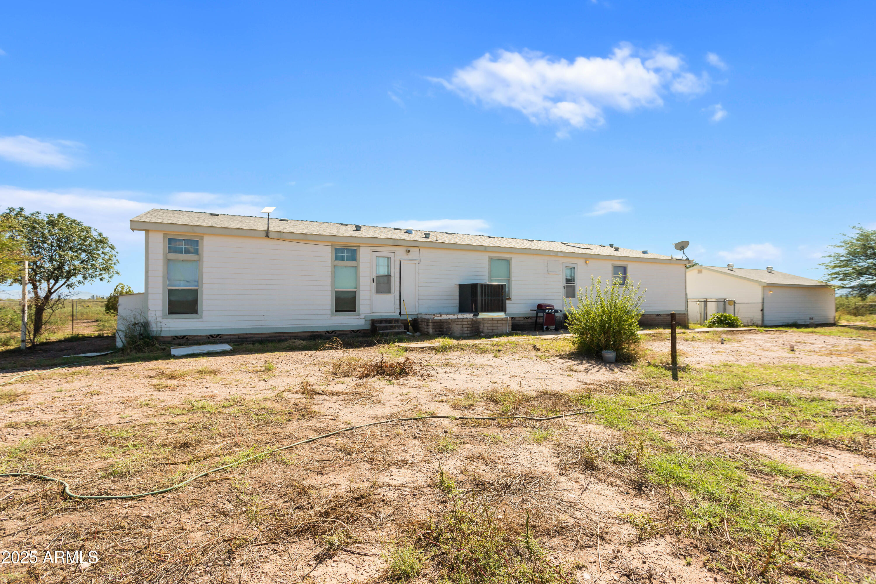 3526 West Rak Road Douglas, AZ 85607 - Photo 30 of 51 a view of a house with a yard