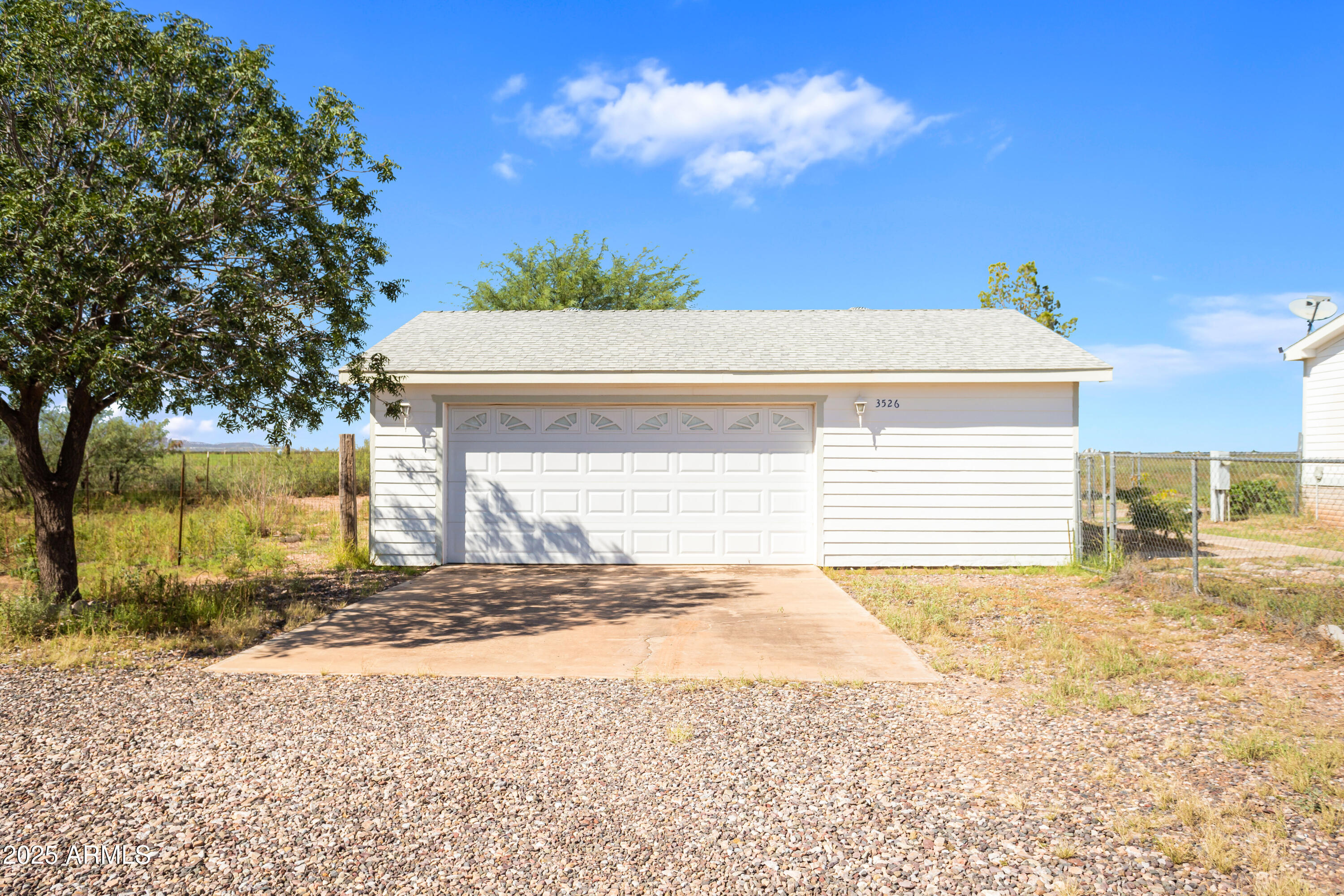 3526 West Rak Road Douglas, AZ 85607 - Photo 3 of 51 a view of a backyard of the house