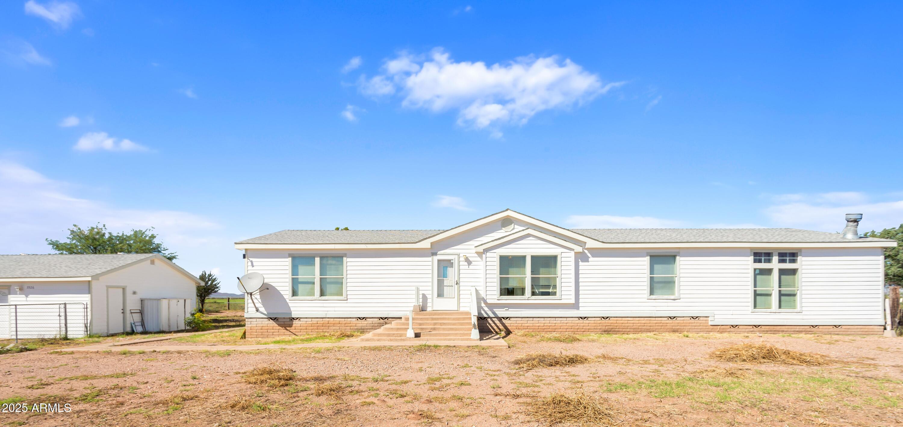3526 West Rak Road Douglas, AZ 85607 - Photo 50 of 51 a view of a house with snow on the background