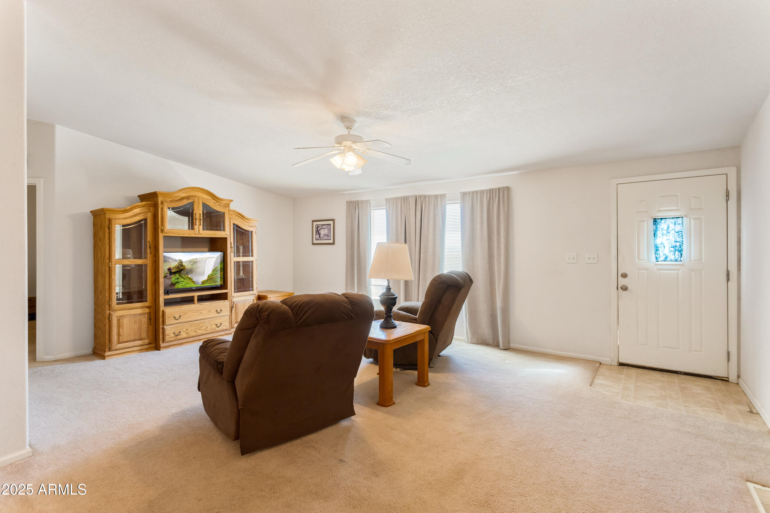 3526 West Rak Road Douglas, AZ 85607 - Photo 6 of 51 a living room with furniture and a window