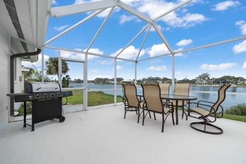 437 Hickory Road Venice, FL 34293 - Photo 14 of 33 a patio with a table and chairs