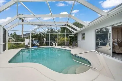 a view of a backyard with a swimming pool