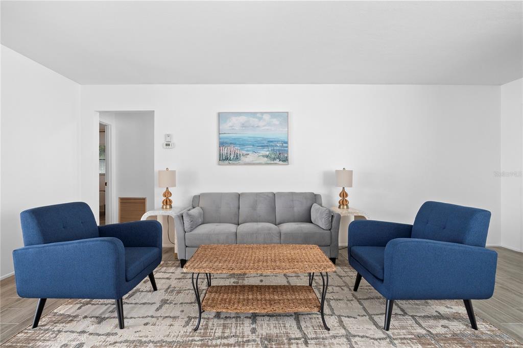 437 Hickory Road Venice, FL 34293 - Photo 18 of 33 a living room with furniture and a couch