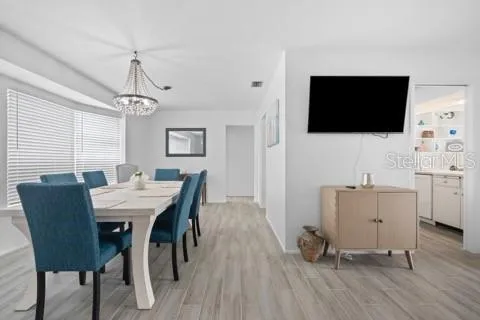 a view of a livingroom with furniture and a flat screen tv
