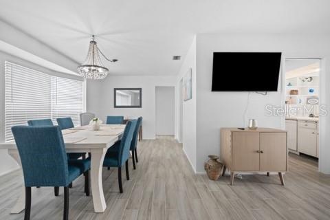 437 Hickory Road Venice, FL 34293 - Photo 30 of 33 a view of a livingroom with furniture and a flat screen tv
