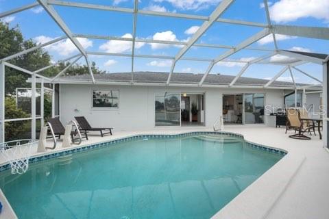 437 Hickory Road Venice, FL 34293 - Photo 32 of 33 a view of a swimming pool with a patio