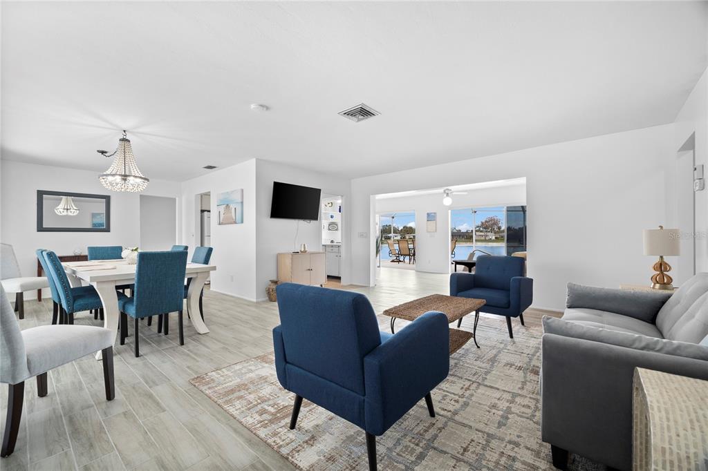 437 Hickory Road Venice, FL 34293 - Photo 4 of 33 a living room with furniture wooden floor and a flat screen tv