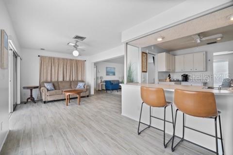 437 Hickory Road Venice, FL 34293 - Photo 5 of 33 a living room with furniture and a wooden floor