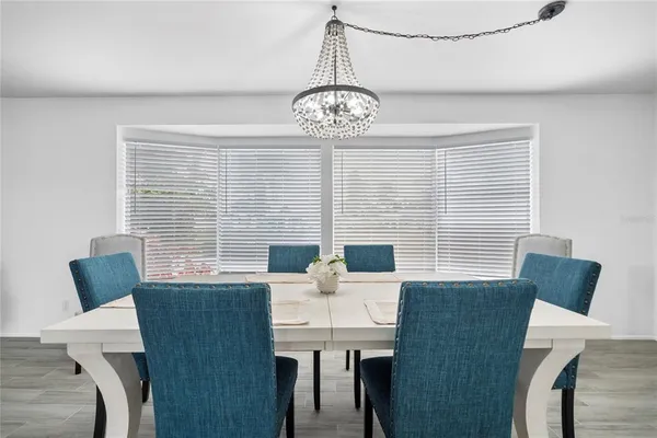 a view of a dining room with furniture window and outside view